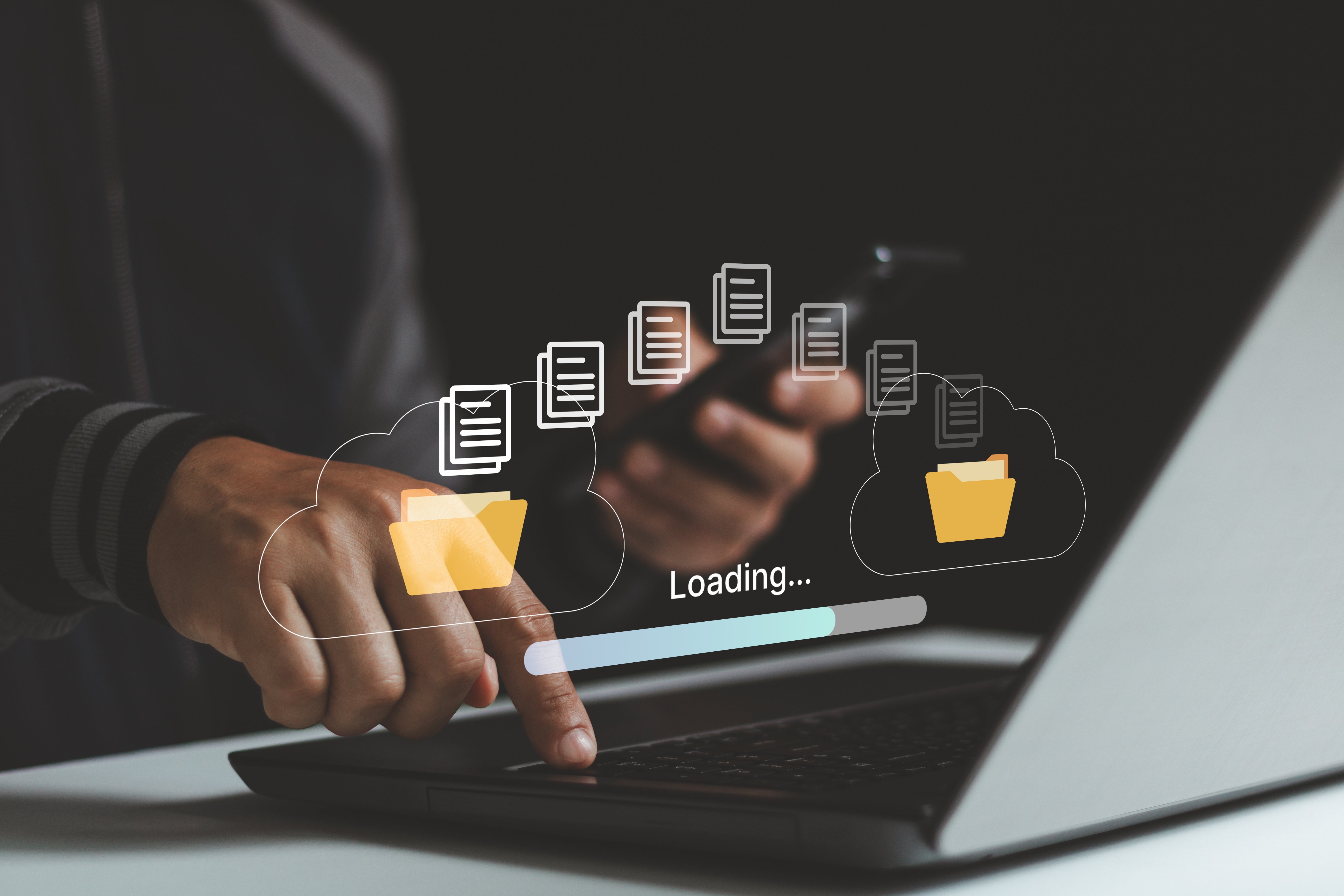 A person using a laptop and smartphone, with overlaid graphics of cloud folders and documents illustrating digital file archiving. A loading bar suggests files are being uploaded or preserved. The image emphasizes archiving important data in the cloud rather than deleting it.